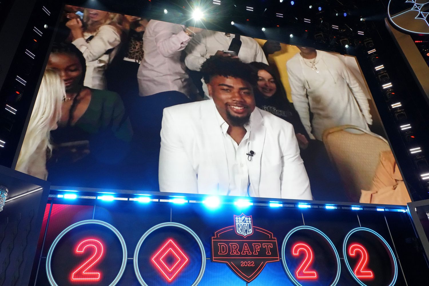 Arkansas wide receiver Treylon Burks reacts after being selected as the eighteenth overall pick to the Tennessee Titans during the first round of the 2022 NFL Draft at the NFL Draft Theater.